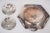 This beautiful set of decorative silver dishes are decorated with charming designs showing children walking dogs. The...