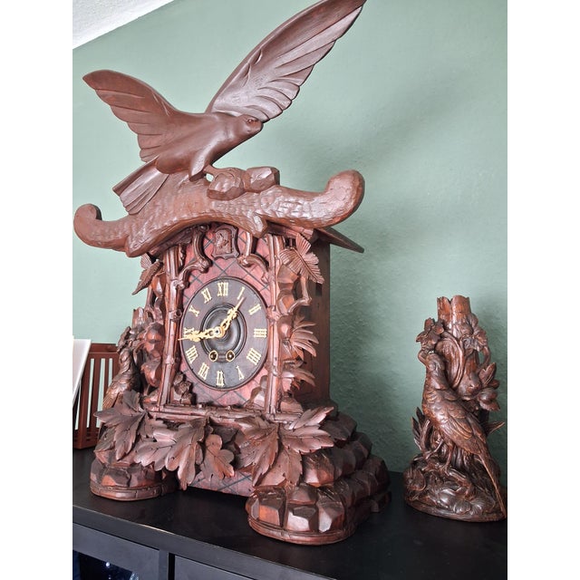 This walnut wood mantel clock is the work of the renowned Black Forest clockmaker Alexander Fleig. The artist was famous...