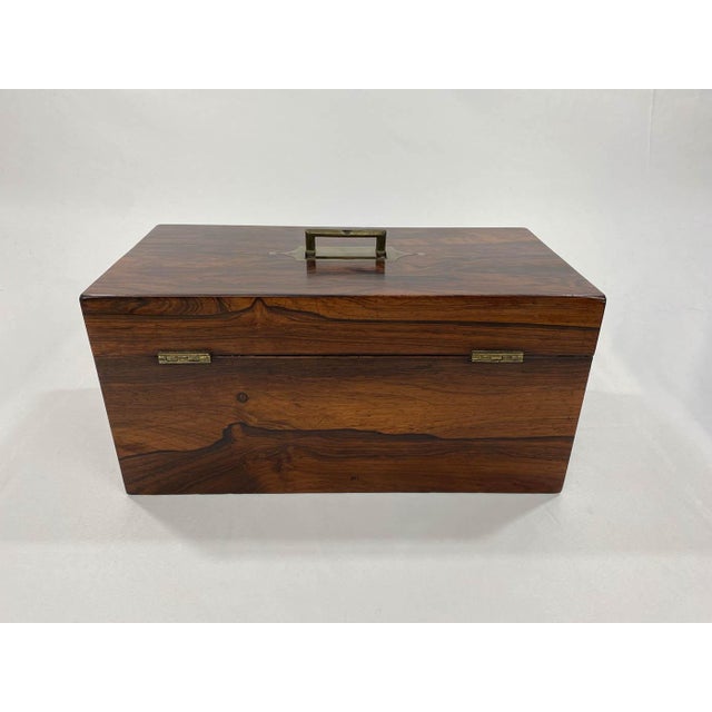 This beautiful antique tea caddy was made in England in the 19th century. It features gorgeous ivory wood and is in great...