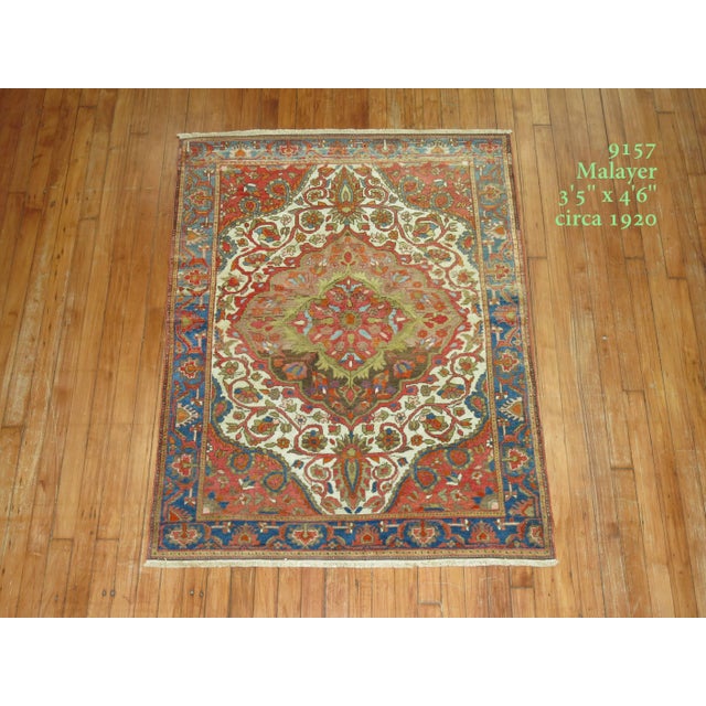 A colorful formal fine quality connoisseur level Persian Malayer rug. Ivory ground with soft mutli brown color medallion,...