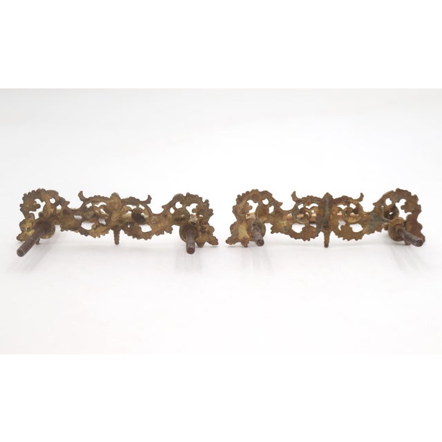 Victorian style bail drawer pulls made of brass with filigree scrollwork. The original mounting nuts are not included....