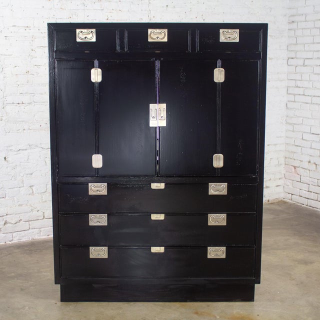Fabulous vintage Modern Campaign or Hollywood Regency black lacquered entertainment cabinet or armoire with recessed base,...