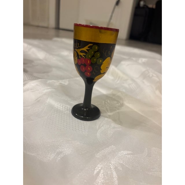 Vintage wooden khokhloma chalices hand painted with red, black, gold, and a floral design. 6 large sized, 6 small sized....