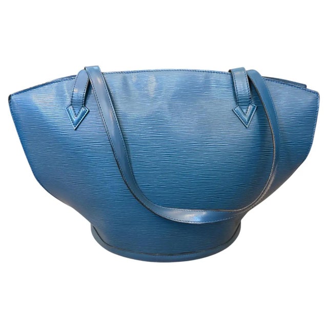 This striking vintage Louis Vuitton Saint Jacques handbag in Toledo Blue Epi leather is a masterpiece of architectural...