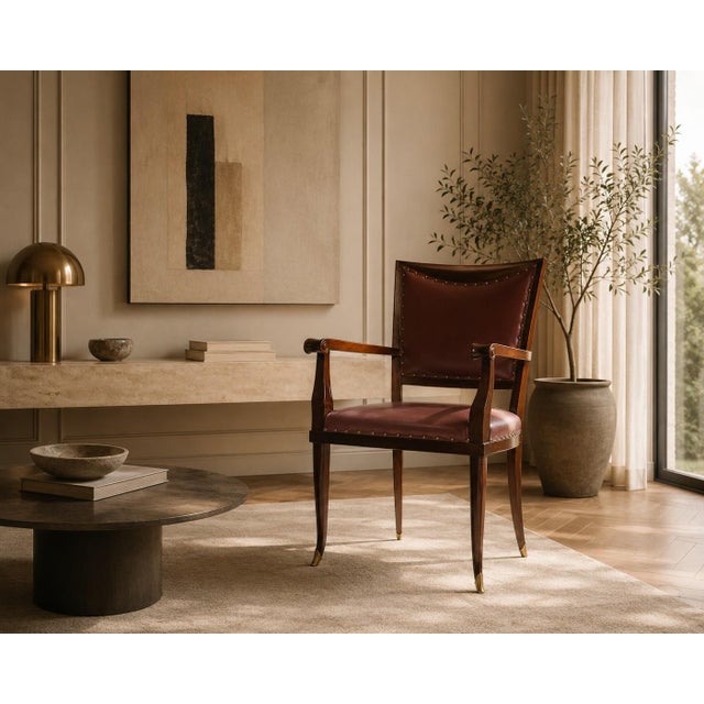 This elegant Italian Mid-Century desk armchair, designed by Vittorio Dassi and produced during the 1950s, reflects the...