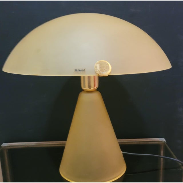 Table lamp in yellow frosted Murano glass and golden metal designed by VeArt in the seventies. The yellow frosted glass is...