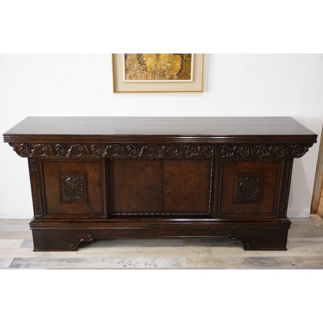 This antique oak sideboard, dating from the late 19th to early 20th century, is in the Neo-Renaissance style and finely...