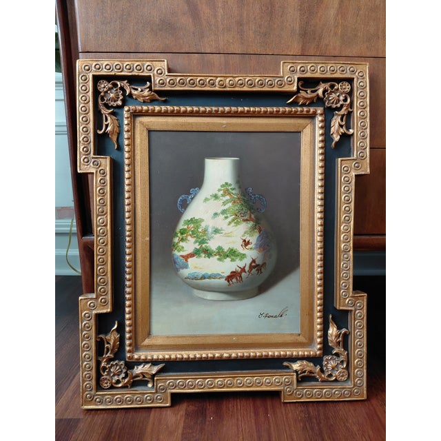 A striking set of three decorative still life paintings depicting ornate porcelain vessels in richly detailed chinoiserie...
