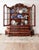 Elegant traditional china cabinet featuring a richly figured mahogany finish and classic baroque-inspired lines. The upper...