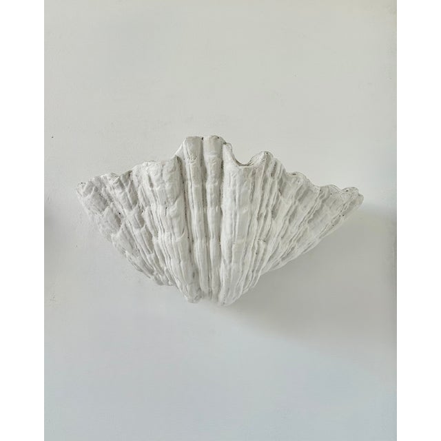 Pair of wall sconces attributed to serge roche, composed of a thick plaster structure, produced in france in the 1940s....