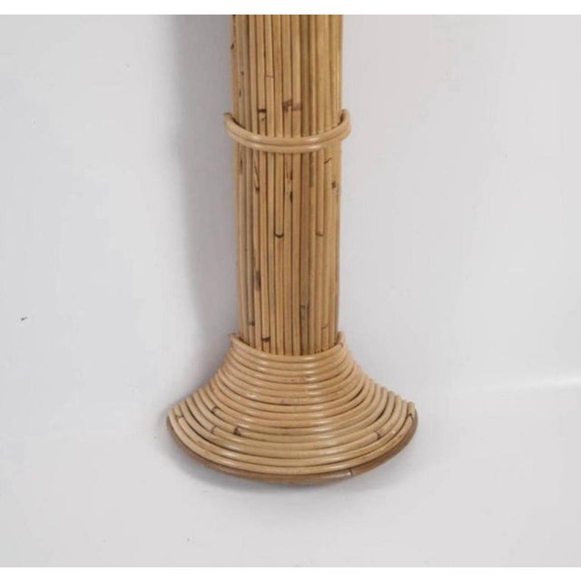 Stunning pair of large rattan wall sconces depicting coconut palms. The fronds are removable and can be arranged as...