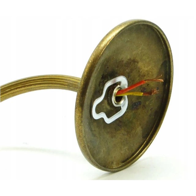 The eclectic wall lamp comes from the beginning of the 20th century. It is in good condition and has a delicate patina....