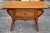 A Southeast Asian Carved Fruitwood Console/ Altar Table with wicker front. Measures 35.5" in width, 14" in depth and 28.5"...