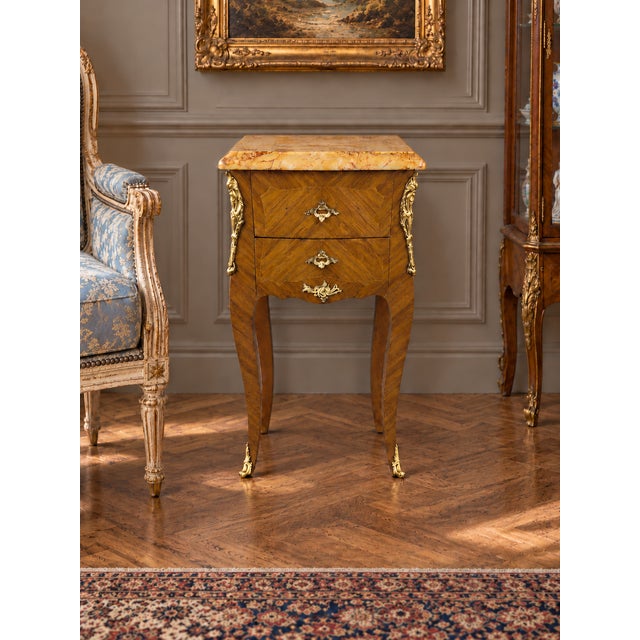 Elegant 19th century French Empire gueridon in mahogany, featuring a substantial marble top with warm ochre veining and...