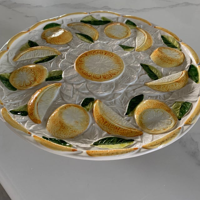 A charming serving piece made in Portugal! Citrus motif with 3D details throughout. Would look lovely with a lemon...