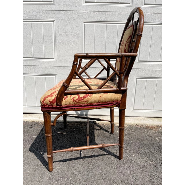 A faux bamboo oak armchair in the Chinese Chippendale manner. late 19th century English with Inset brocade back and seat...
