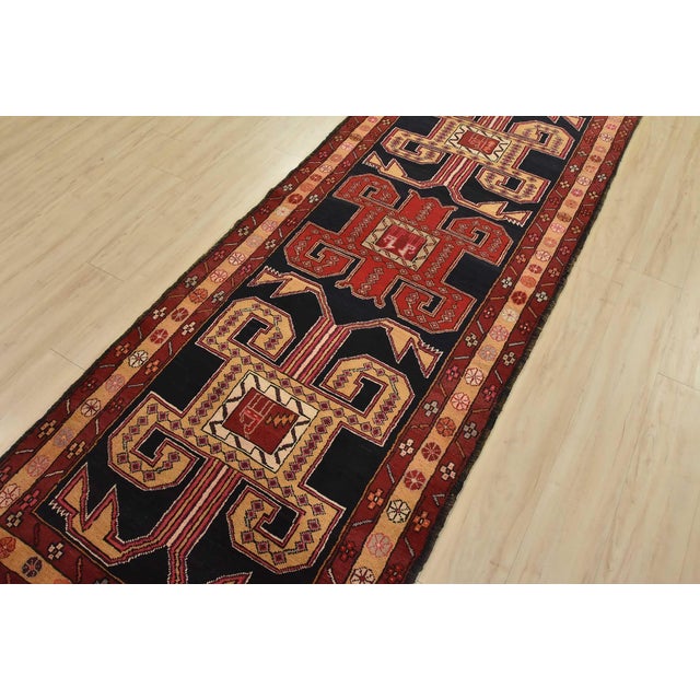 An authentic vintage tribal Ardabil runner hand-knotted with fine wool and natural dyes. This nomadic oriental rug...