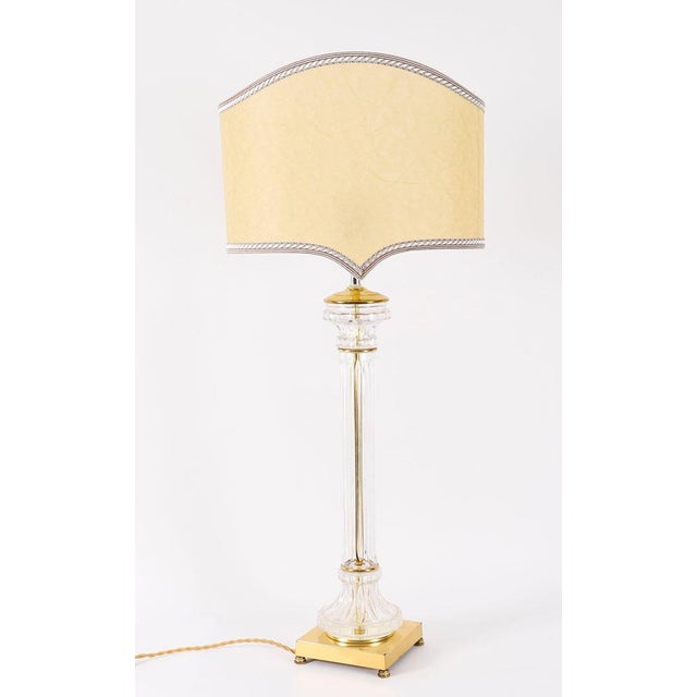 This is a monumental pair of Art Deco glass column table lamps with superb golden silk shades, Circa 1920 in date. The...