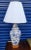 A beautiful blue and white vintage floral ginger jar style table lamp. The lamp features pretty floral design with wood...