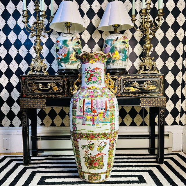 Monumental 3 foot Chinese porcelain floor vase featuring famille rose decoration with large figural courtyard scenes,...