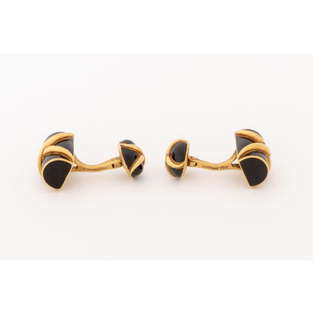 Schlumberger for Tiffany and Company Pair of 18K Yellow Gold and Black Enamel Cufflinks, featuring applied back enamel...