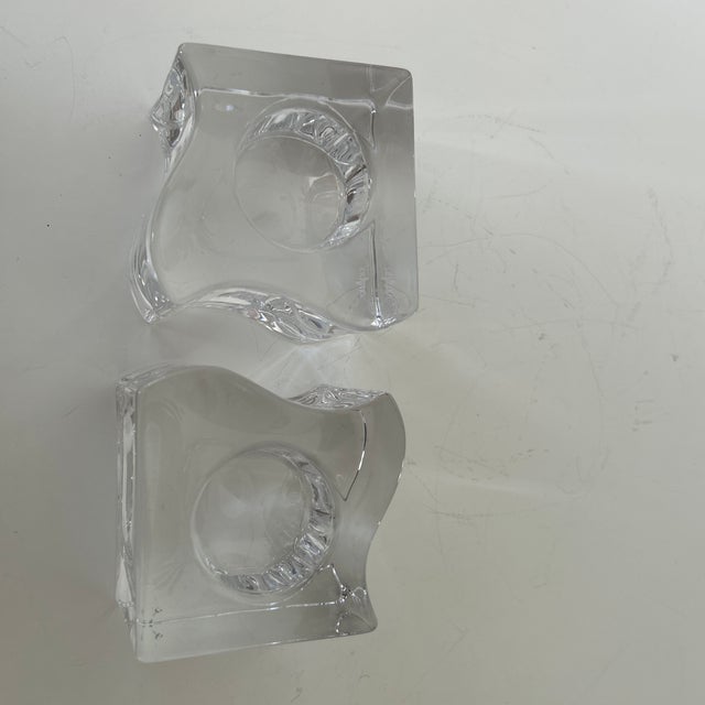 Sculptural pair of vintage crystal candle holders by Orrefors of Sweden. Each features a substantial geometric block form...