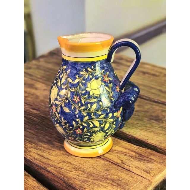 This Vintage Hand Painted Colorful Ceramic Talavera Pitcher is a unique and beautifully crafted piece that adds a touch of...