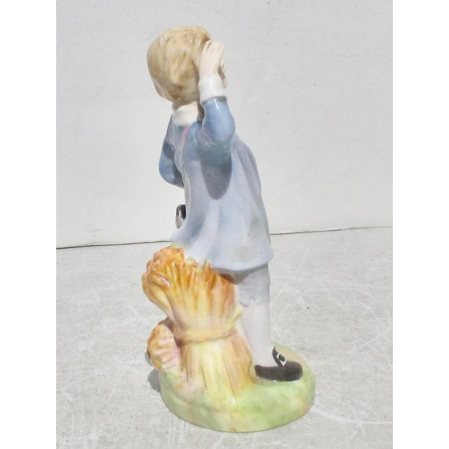 Little Boy Blue, a well-known nursery rhyme figure issued by Royal Doulton circa 1950-70s. Hallmarked to the bottom with...