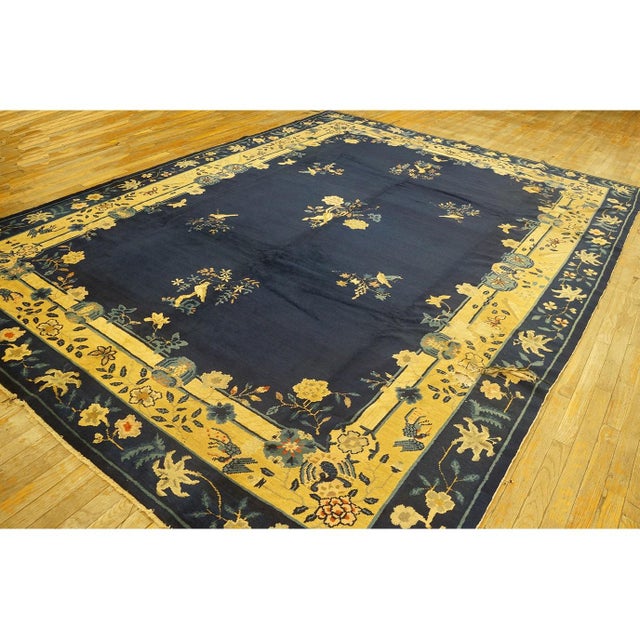 Antique Peking Chinese Floral Blue Navy, Camel 1920s Rug, Circa Date: 1920s. This exceptional example of early 20th-...