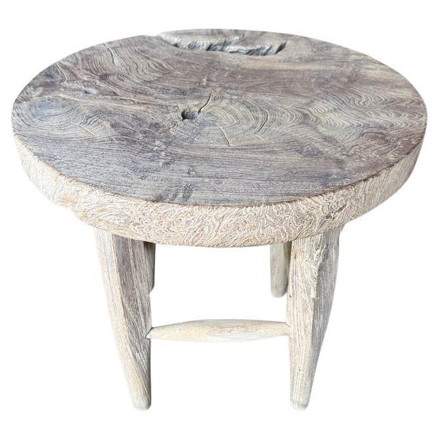 An impressive thick piece of aged teak wood from my private collection, is hand carved into this unique side table, whilst...