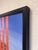 This artwork features a serene landscape dominated by a large, majestic tree reflected in a tranquil body of water. Bold...