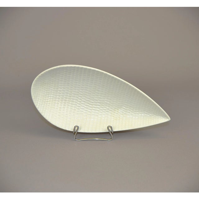 Leaf-shaped dish , "Reptil" Stig Linderberg for Gustavberg with embossed design on the body, covered with a matte pale...
