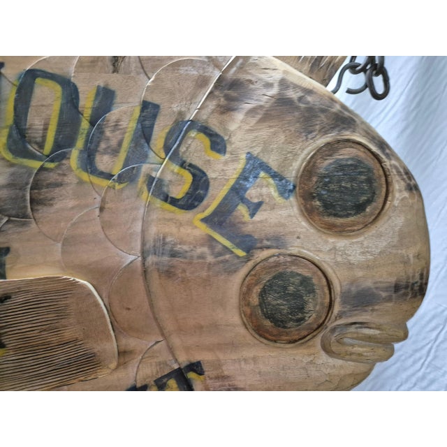Hand carved flounder trade sign with painted lettering for "Beach House Inn, Brant Point". With blue lettering outlined in...