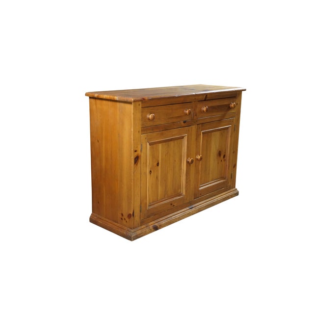 The Ethan Allen Old Tavern Pine Country Farmhouse Buffet Console Cabinet (Model 23-6006) is a rustic, low-profile storage...