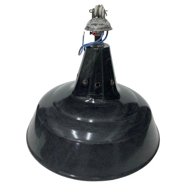 Three industrial pendants designed and manufactured in Italy in the Thirties, they are in original conditions with signs...