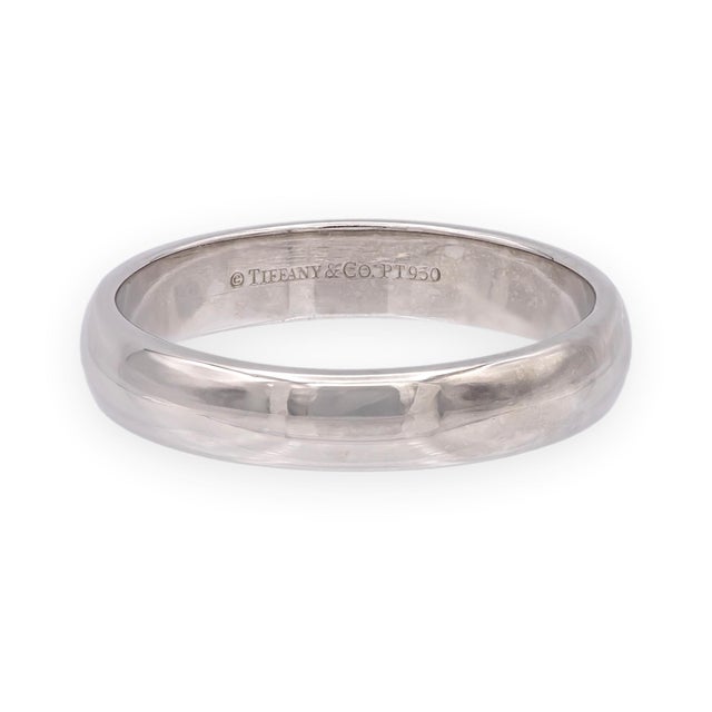 A clean, substantial men's wedding band from Tiffany's Forever collection in platinum. The smooth, rounded comfort-fit...