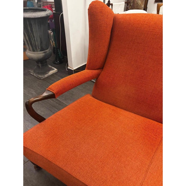 Elegant bench from the late Biedermeier period (circa 1850–1860) with a curved backrest and delicate wooden arms. Walnut....