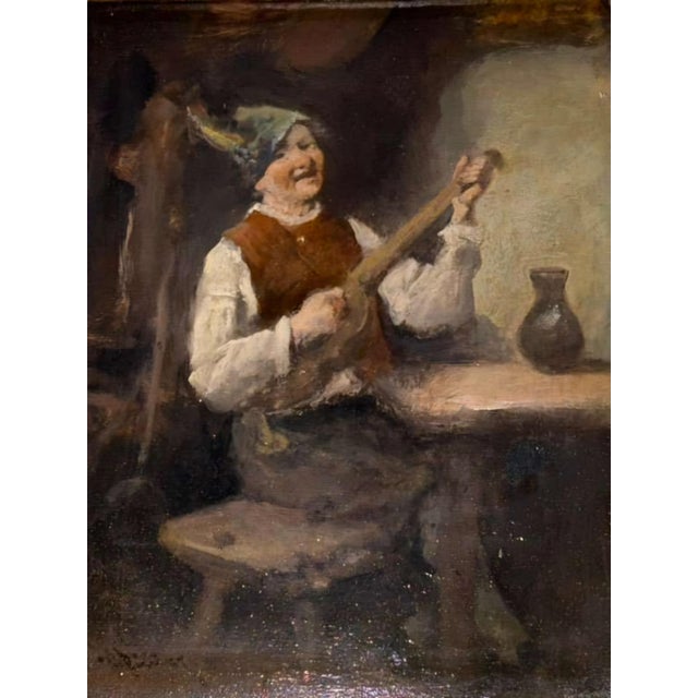 Charming early 19th-century Dutch genre scene depicting a seated musician in a rustic interior, playing a stringed...