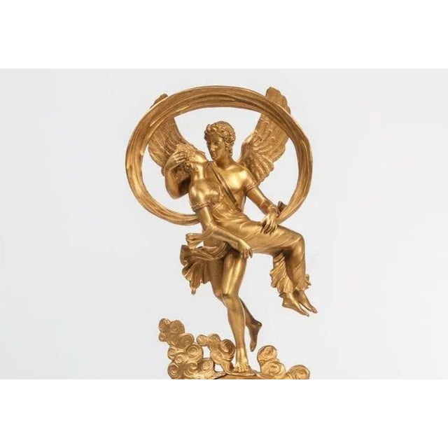 Restoration period gilt bronze mantel clock, with representation of Eros removing Psyche under clouds surmounting a globe...