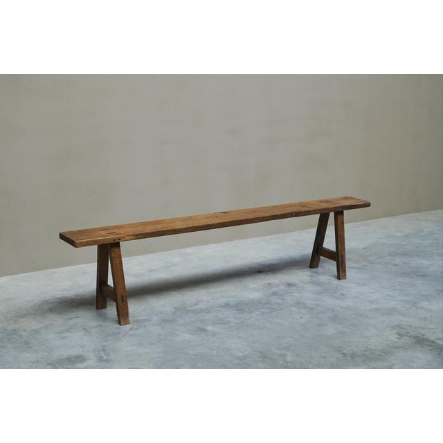 A wonderful early 20th century provincial bench in solid oak. Most probably France, 1910-1940. Utilitarian of origin, this...