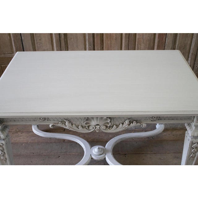 20th century carved and painted neoclassical style centre table Paint finish is new in a soft oyster white finish, subtle...