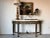 This vintage Maitland-Smith console table is a statement piece that exudes grandeur and old-world craftsmanship. Designed...
