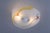Original 1950s glass ceiling light, with cheerful colours and elegant gold accents. The gilded details nod to the glamour...