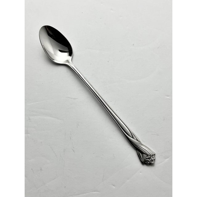 Oneida “Katrina” Set of 12 Stainless Iced Tea Spoons” 7 3/8” Good vintage condition. No damage. Length 7 3/8” Circa 1990s