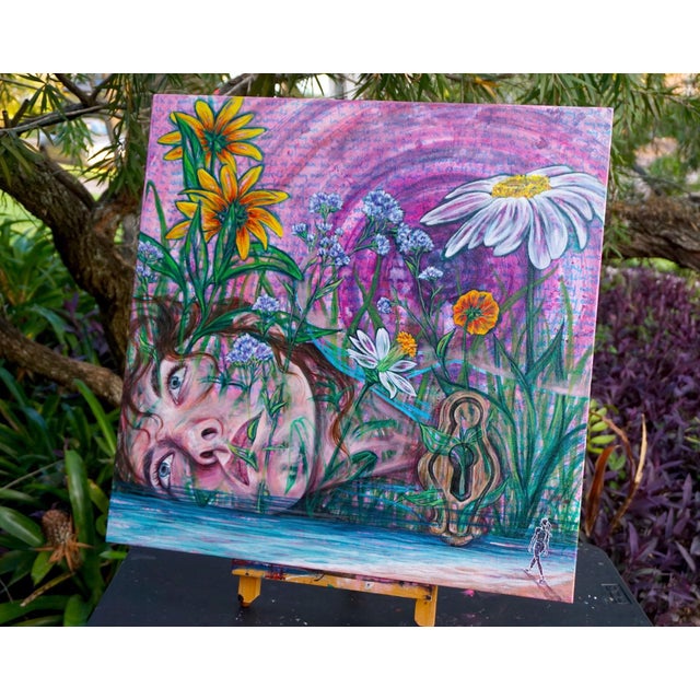 This artwork presents a dreamlike composition where a serene face emerges from a vibrant garden filled with wildflowers,...