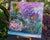 This artwork presents a dreamlike composition where a serene face emerges from a vibrant garden filled with wildflowers,...