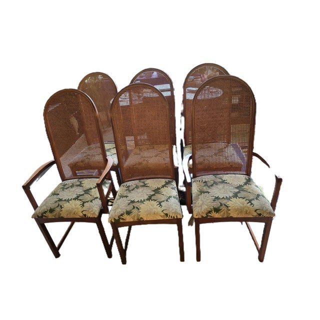 Elevate your dining space with this exceptional set of six mid-century modern high-back dining chairs, designed by the...