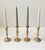 A total of 4 candlestick holders in solid brass - consisting of two diffrent pairs. Manufactured in Denmark circa 1970....
