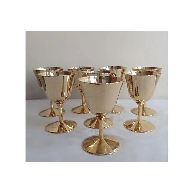 1960s: Hollywood Regency era, Set of 8, 24k gold plated drinks cordials, with interior faceted prism-like, honeycomb...
