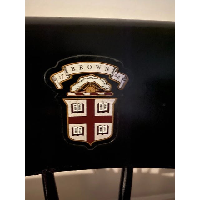 Vintage Nichols & Stone Brown University Black and Brown Windsor Chair with Gold Accents A mid-20th-century Nichols &...